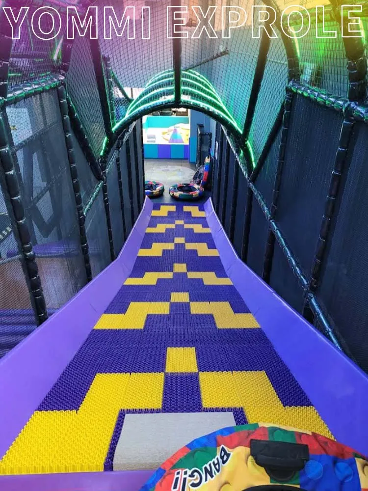 Extreme dry snow drop slide, a high-profit attraction designed for Canadian commercial indoor trampoline parks to mimic winter sports.