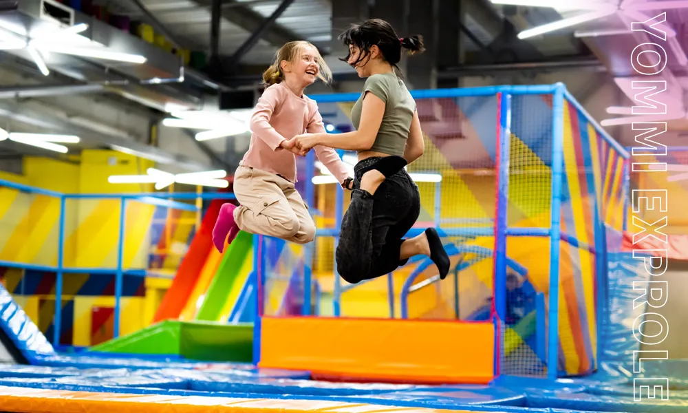 Girls safely enjoying a high-quality free jump zone, highlighting the consistent winter revenue generated by Canadian families.