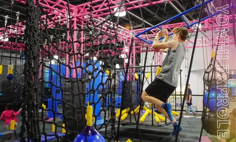 High-challenge ninja warrior course installed in a commercial trampoline park, increasing social sharing and repeat visits from Canadian teenagers.