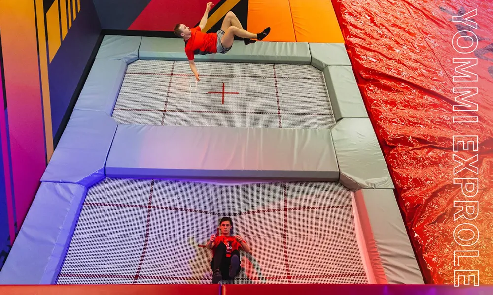 High-performance commercial trampoline zone requiring a minimum of 7 meters of clear building height to safely accommodate extreme kinetic jumps.
