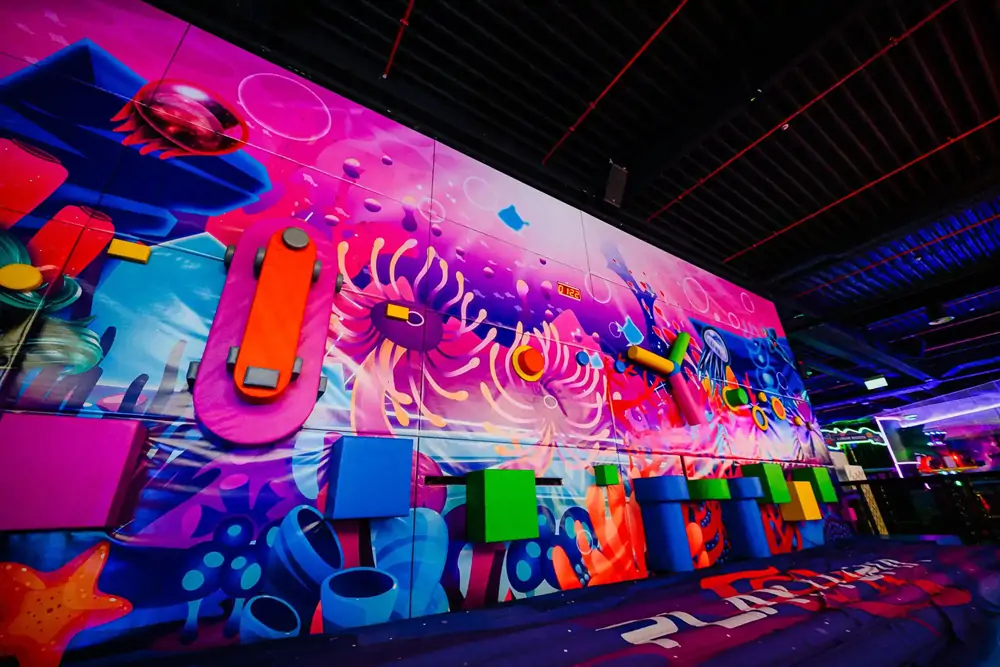 Space and ocean themed interactive wall at Playtopia indoor playground
