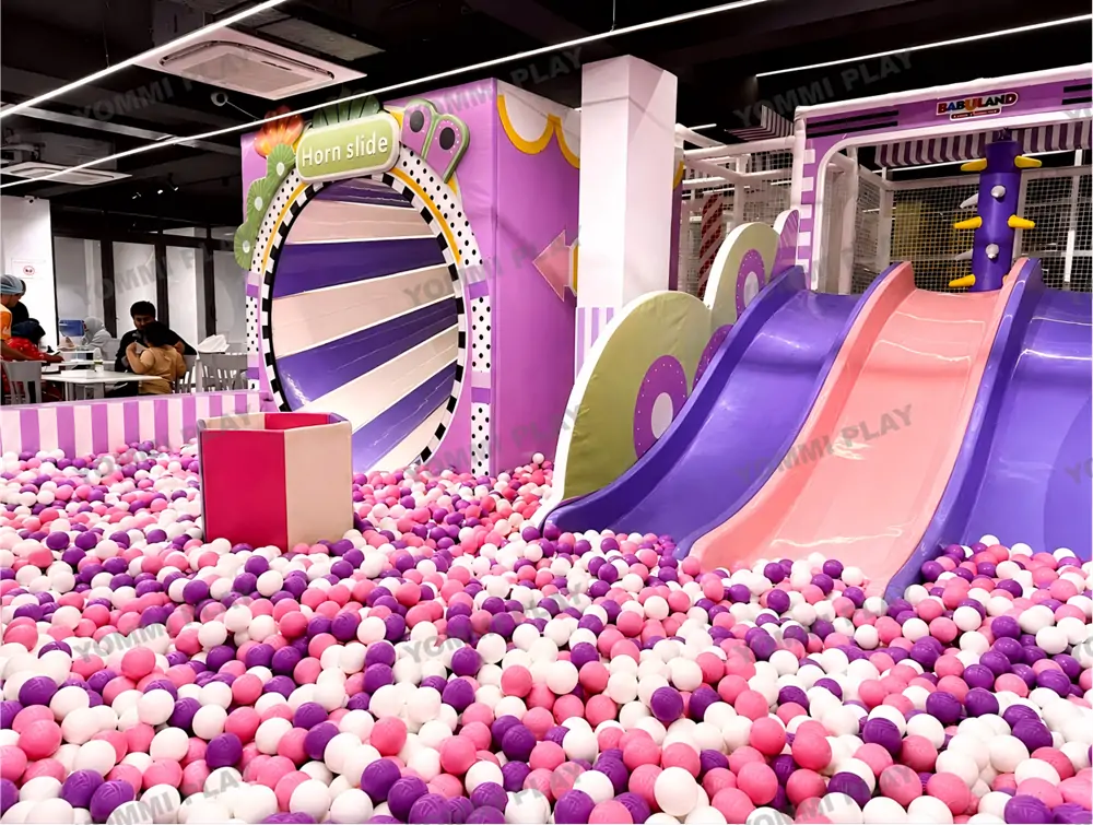 Macaron purple pink custom horn slide and double slide ball pit area of Babuland Banani boutique indoor soft playground in Dhaka, compact commercial kids play equipment for high-end family entertainment center