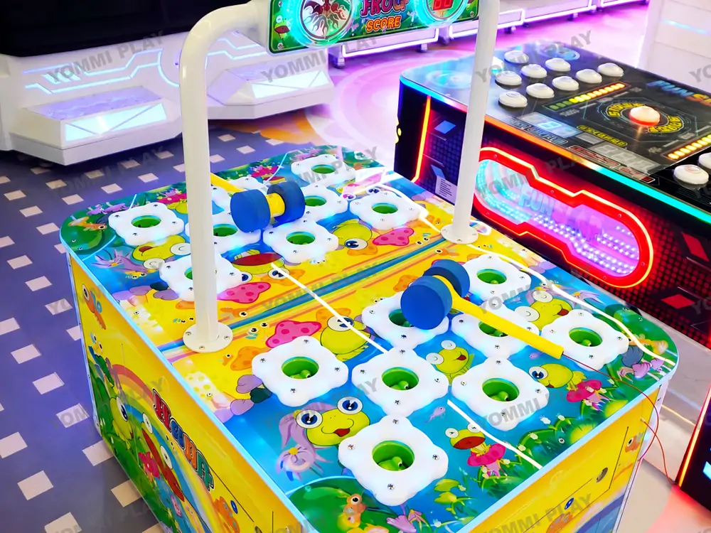 Custom two-player whack-a-frog interactive arcade game inside Babuland Banani indoor playground, matching pastel venue style for competitive parent-child fun suitable for kids aged 8 to 12