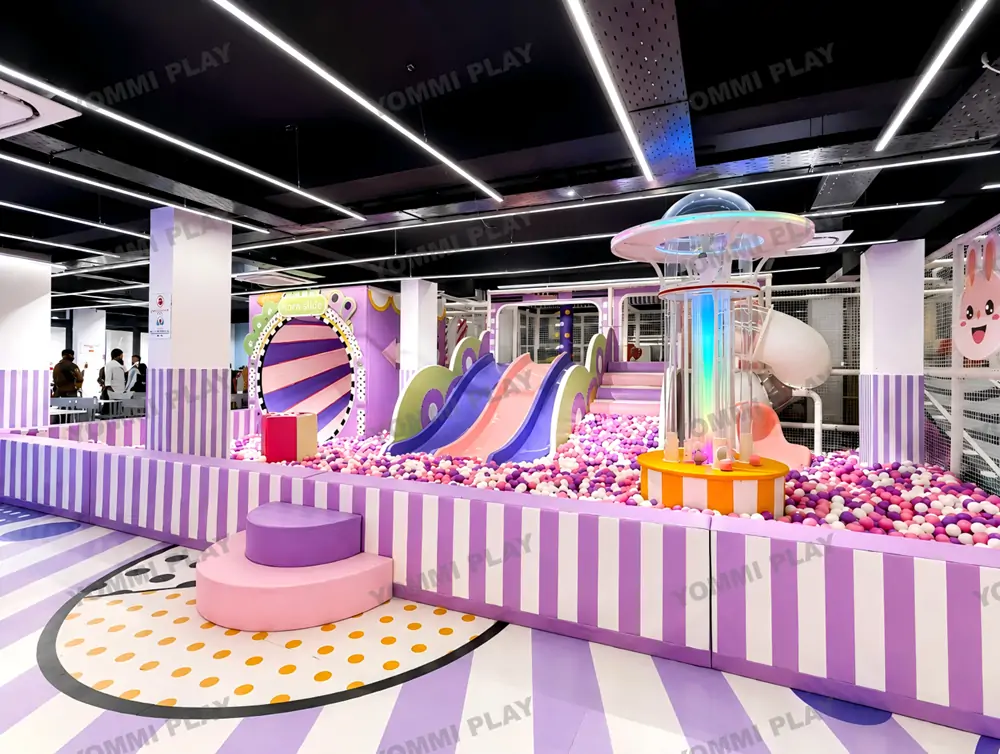Pastel macaron purple pink custom indoor soft playground of Babuland Banani Dhaka, featuring horn slide, double slide, colorful ball pit and jellyfish interactive sensory equipment for boutique compact commercial family entertainment venue